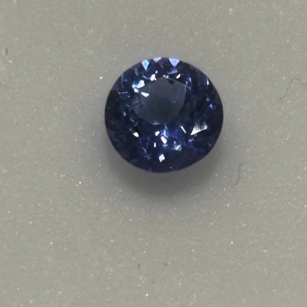 .75CT-Tanzanite-6MM Round - Picture 1 of 7